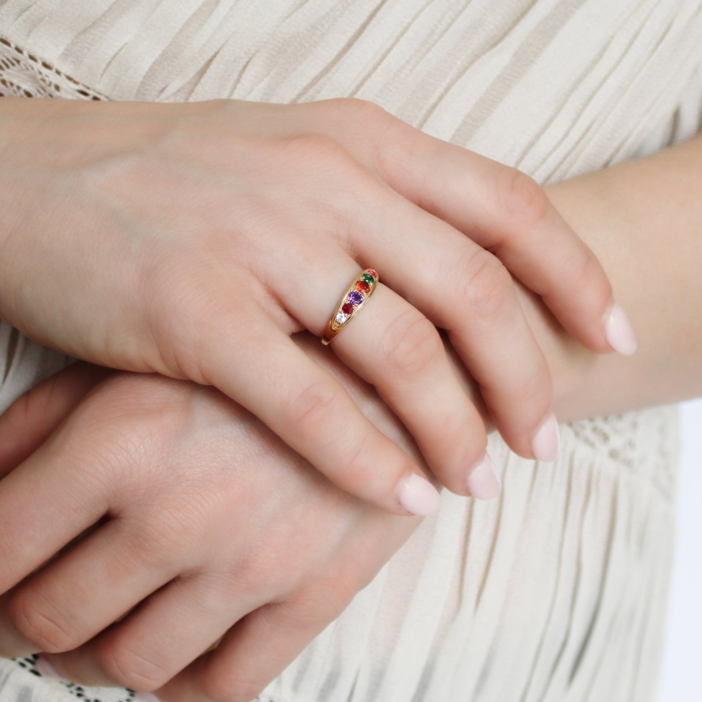 Love Letter Ring 18k gold vermeil on model holding wrist wearing ring, REGARD acrostic jewelry, Ether Jewelry
