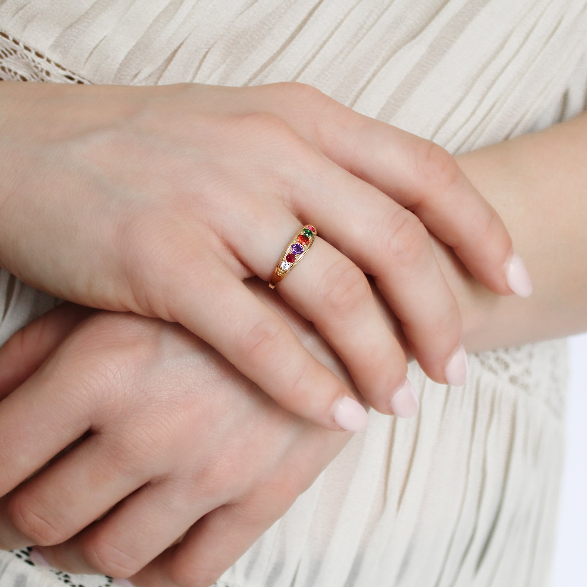 Love Letter Ring 18k gold vermeil on model holding wrist wearing ring, REGARD acrostic jewelry, Ether Jewelry