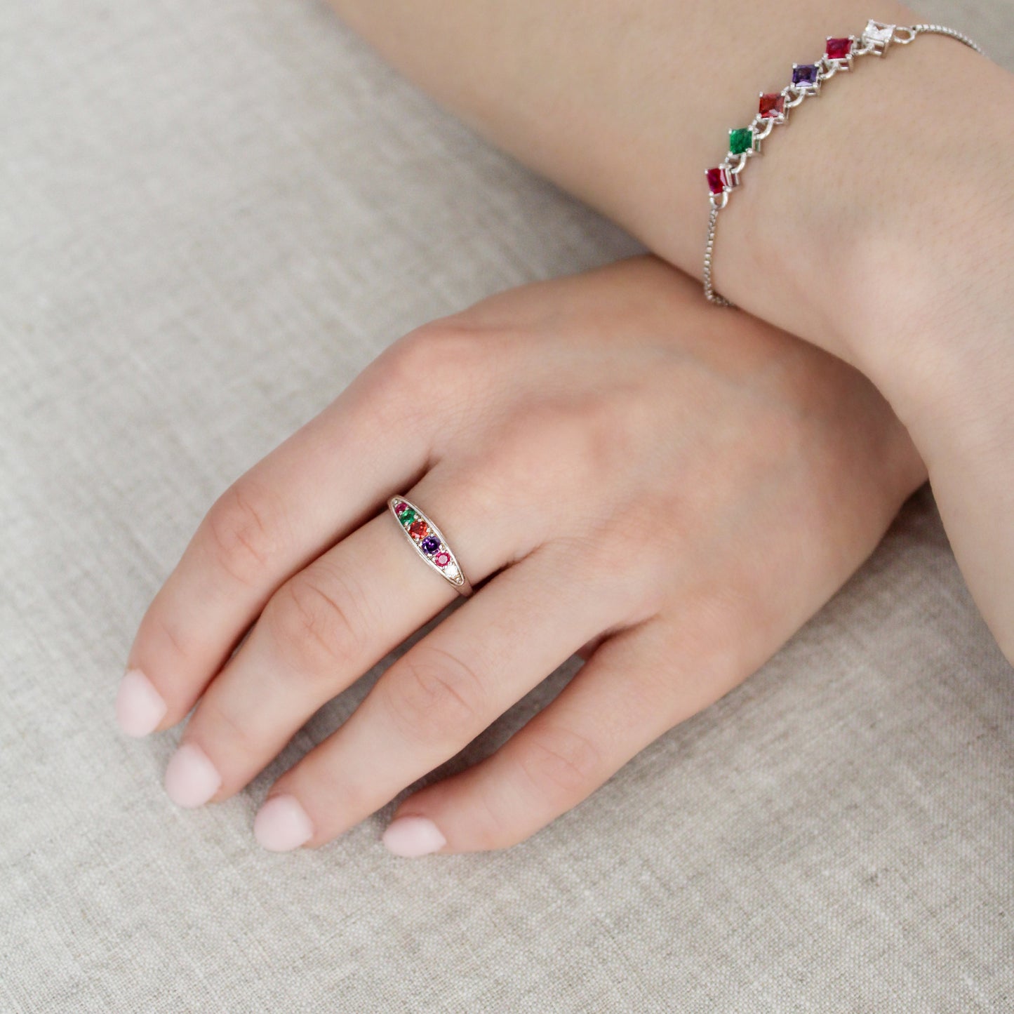 Sterling silver Love Letter Ring on model with matching bracelet, acrostic band close-up, Ether Jewelry