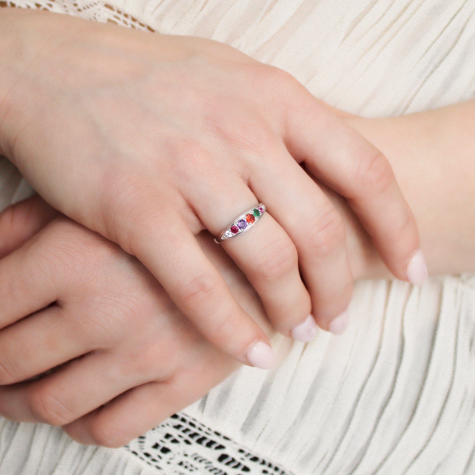 Love Letter Ring sterling silver on model holding wrist wearing ring, REGARD acrostic jewelry, Ether Jewelry