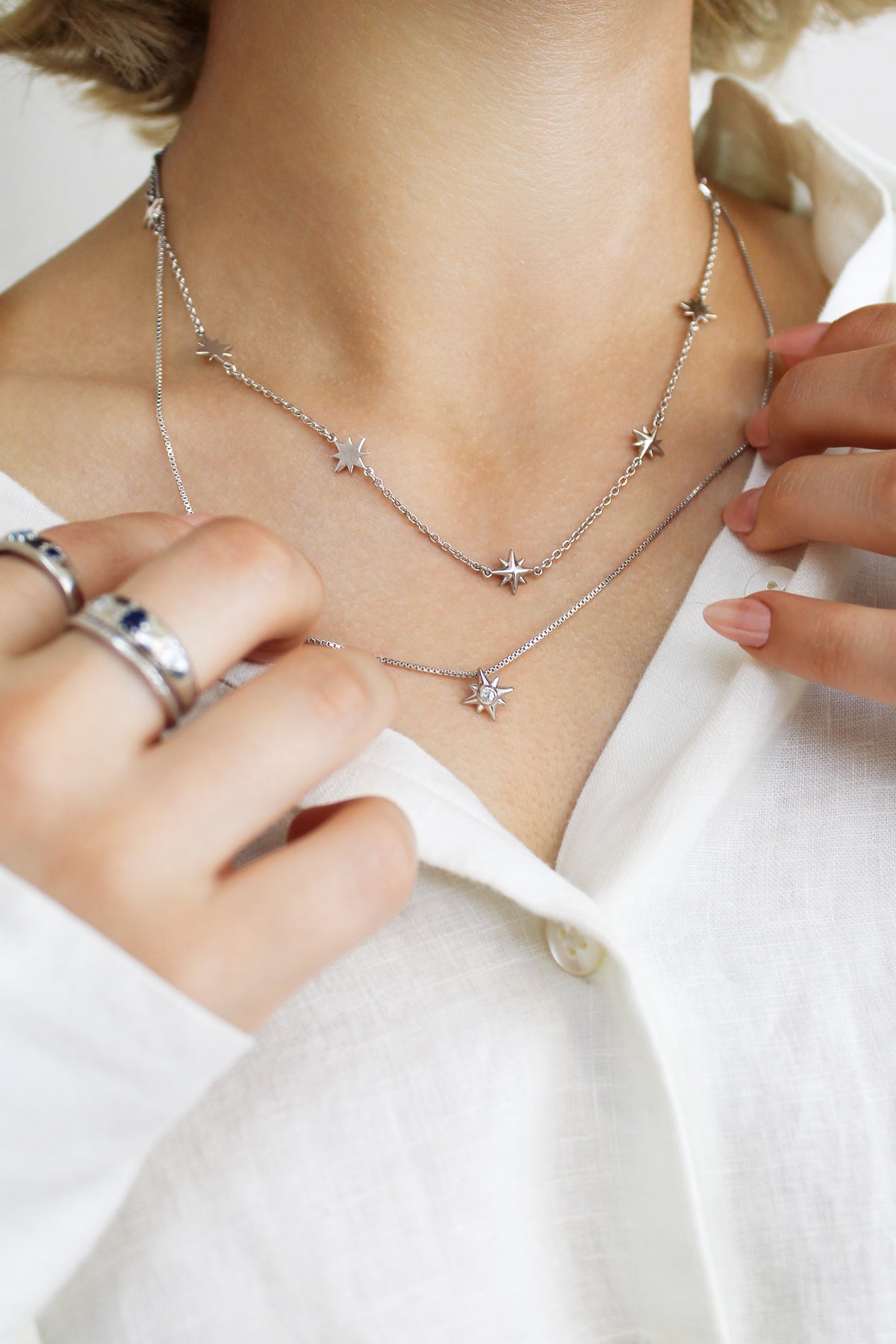 Lucida Necklace and Juno Necklace on model, sterling silver, eight point star stations, celestial jewelry, ether jewelry