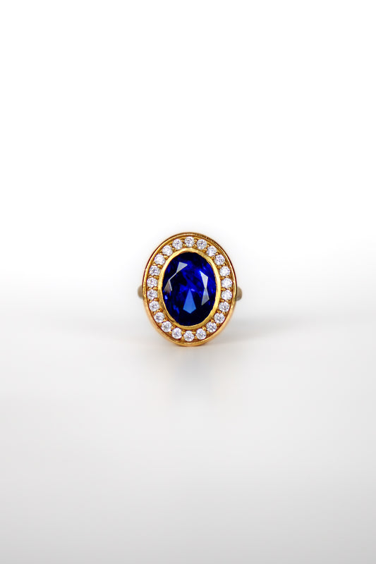 Close-up of The Legacy Ring in gold vermeil with sapphire-toned gemstone inspired by Princess Diana’s iconic jewelry.