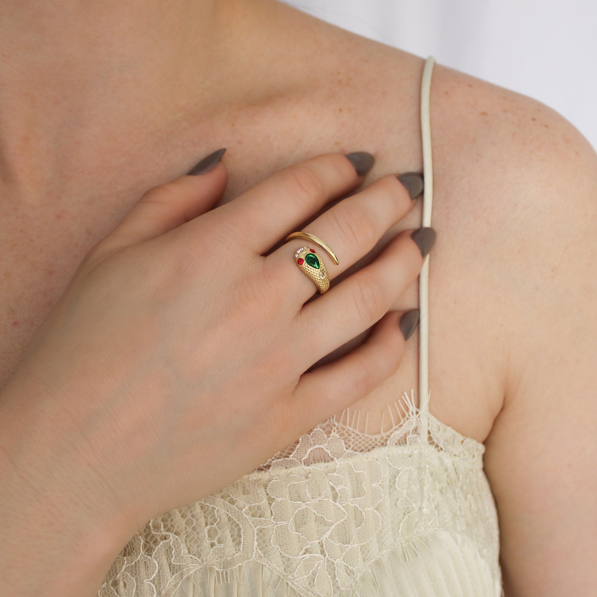 Queen Victoria 18k gold vermeil snake ring worn on finger, close-up of gemstone eye and scale detail, Ether Jewelry