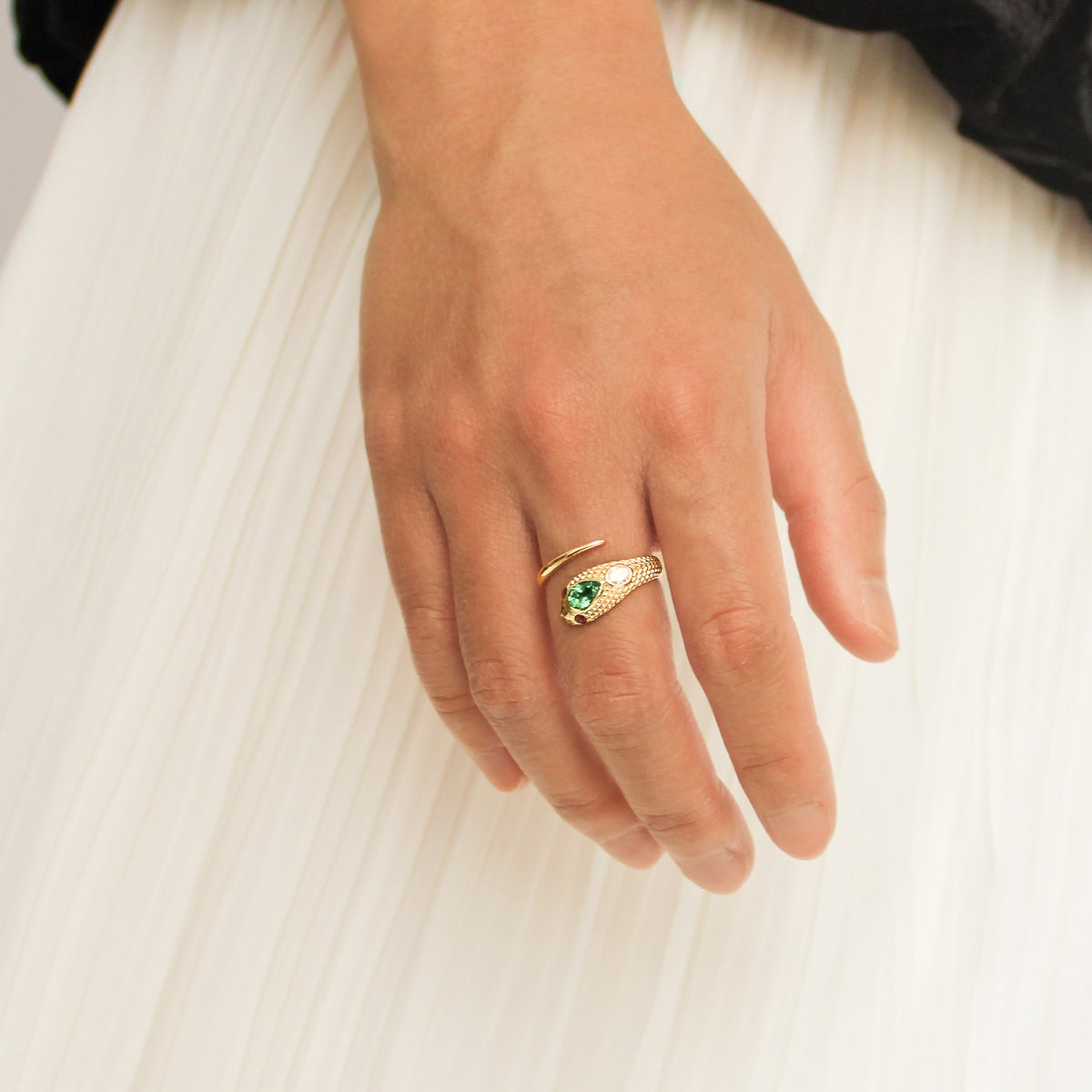 Queen Victoria ring 14k gold close-up on hand showcasing scale engraving detail, lab-grown emerald ruby and diamond serpent ring, Ether Jewelry
