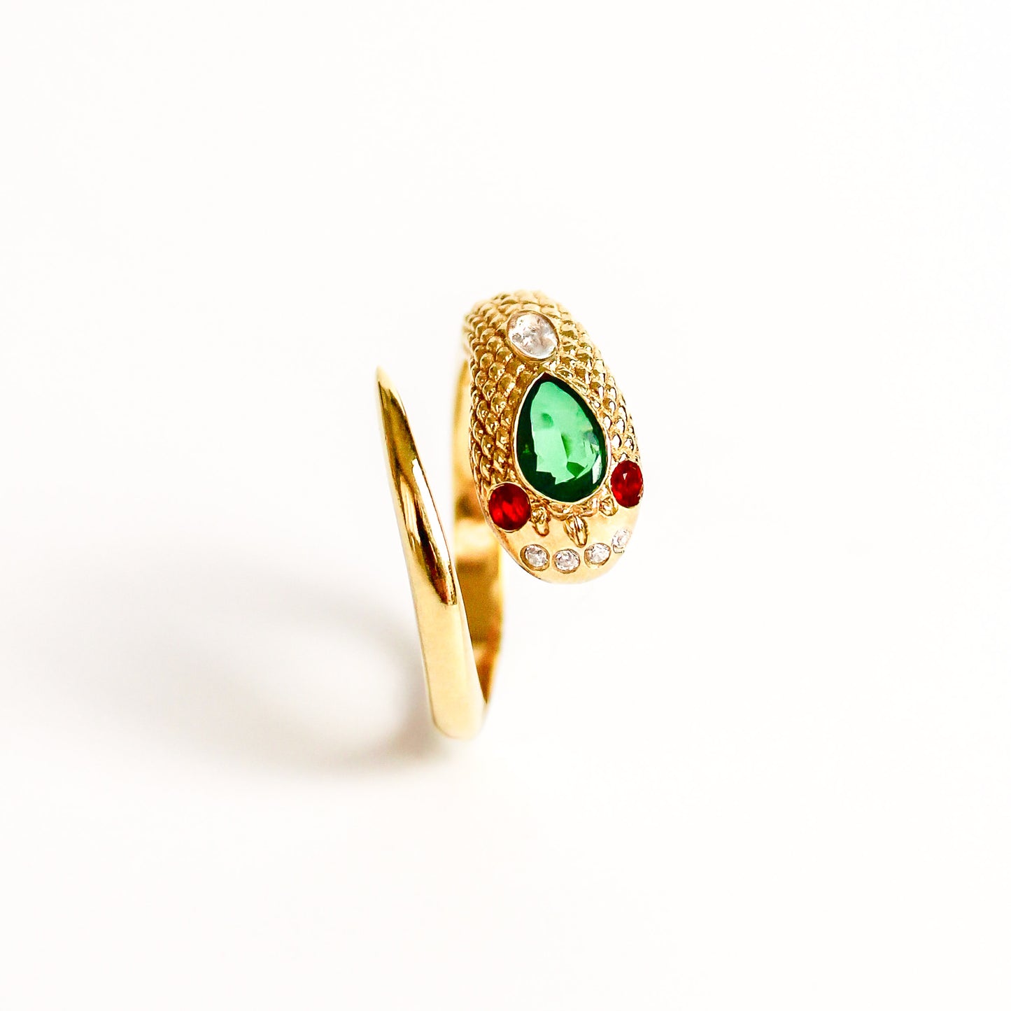 Queen Victoria's Ring in 18k gold vermeil on white background, top down view showing details of scale and gemstones, ether jewelry