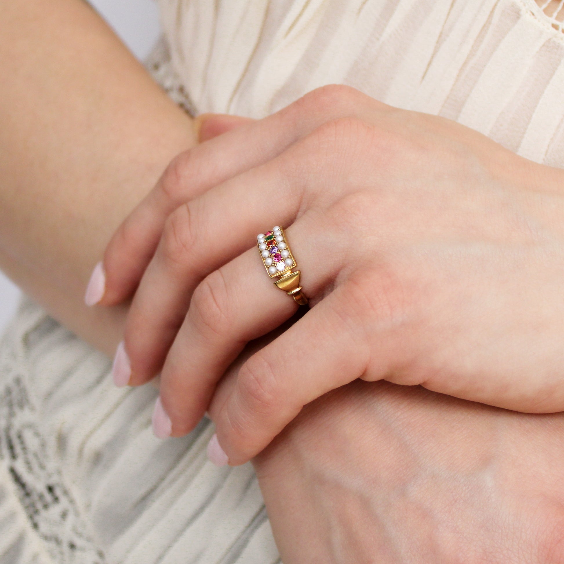 Regent Ring 18k gold vermeil on model holding wrist wearing ring, REGARD acrostic signet jewelry, Ether Jewelry