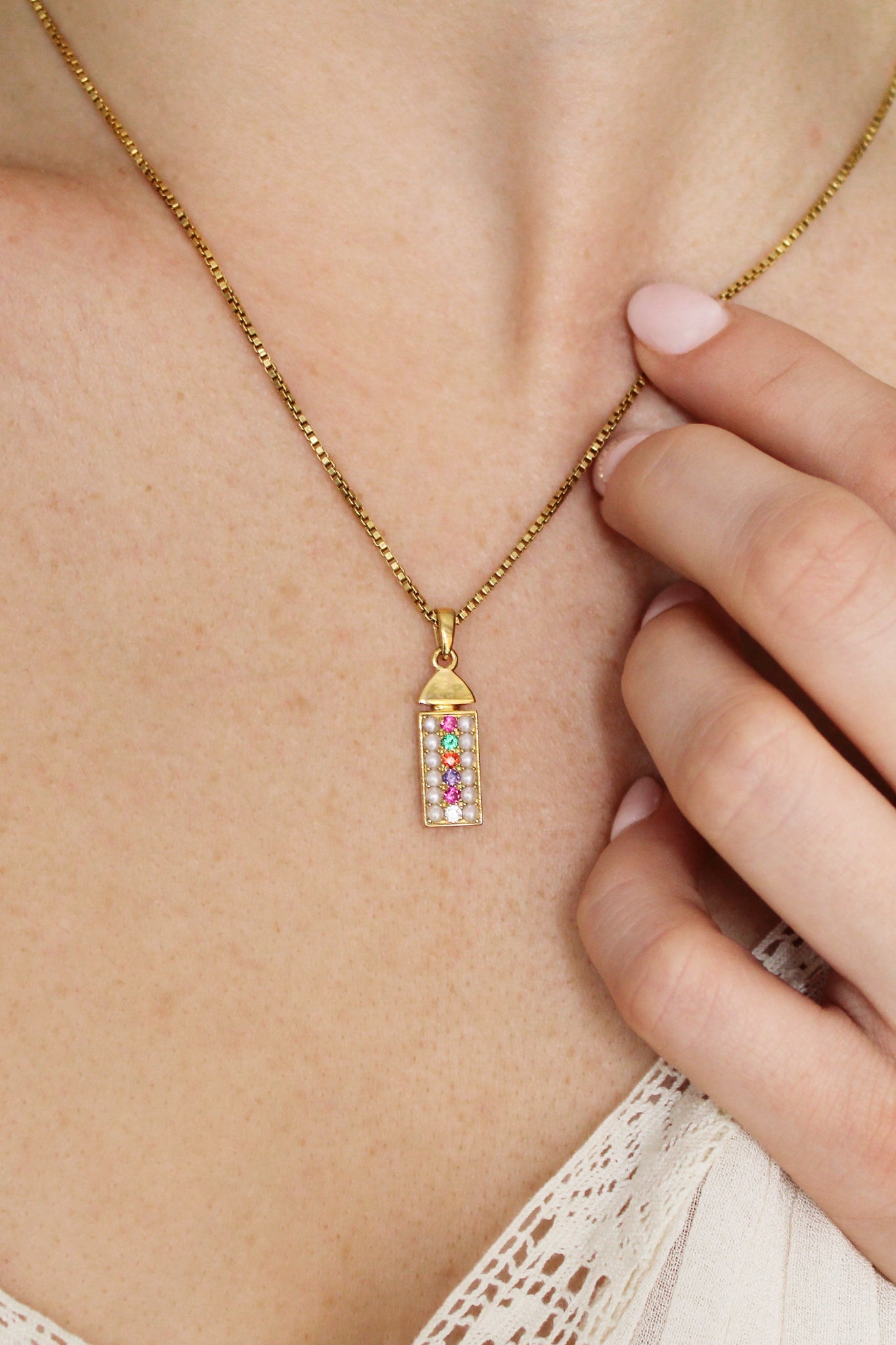 18k gold vermeil Regent Necklace front view on model, cultured pearl and REGARD acrostic CZ rectangular pendant on box chain, Ether Jewelry
