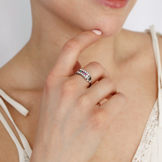Regent Ring in sterling silver worn on model hand in beige dress, pearl-paved REGARD acrostic signet ring, Ether Jewelry