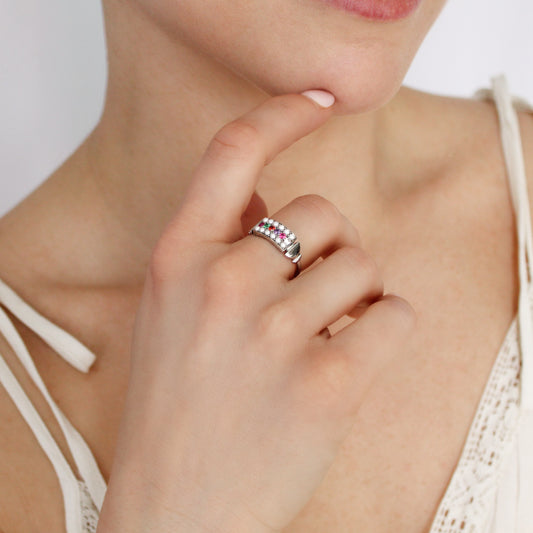 Regent Ring in sterling silver worn on model hand in beige dress, pearl-paved REGARD acrostic signet ring, Ether Jewelry