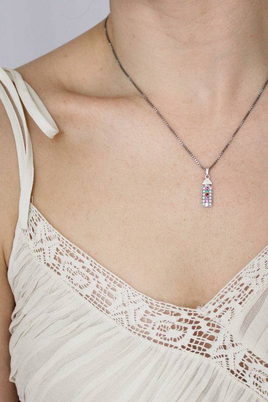 Sterling silver Regent Necklace front view on model, cultured pearl and REGARD acrostic CZ rectangular pendant on box chain, Ether Jewelry