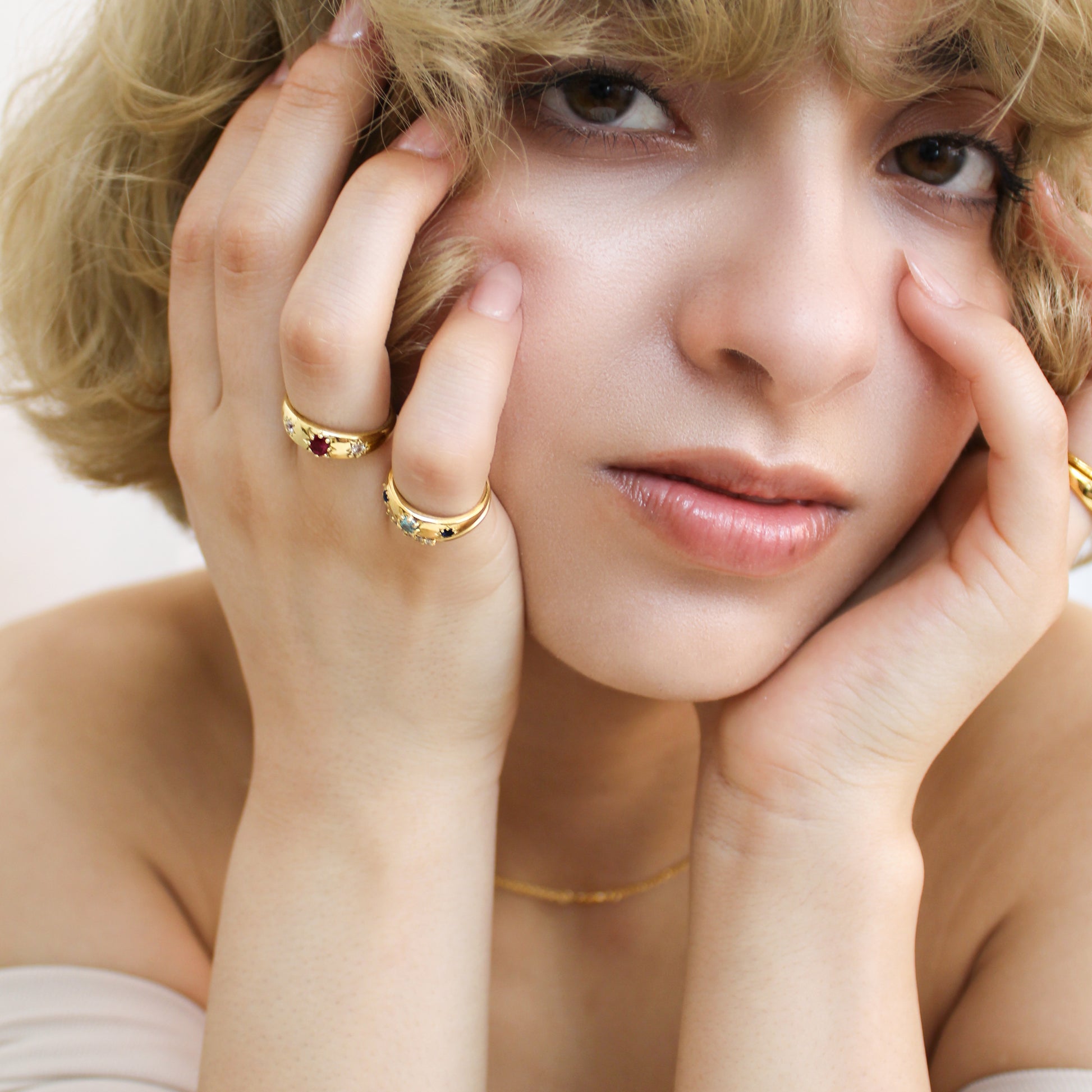 18k gold vermeil Rose from Roma Ring on model with all Roma rings on both hands in front of face, Ether Jewelry