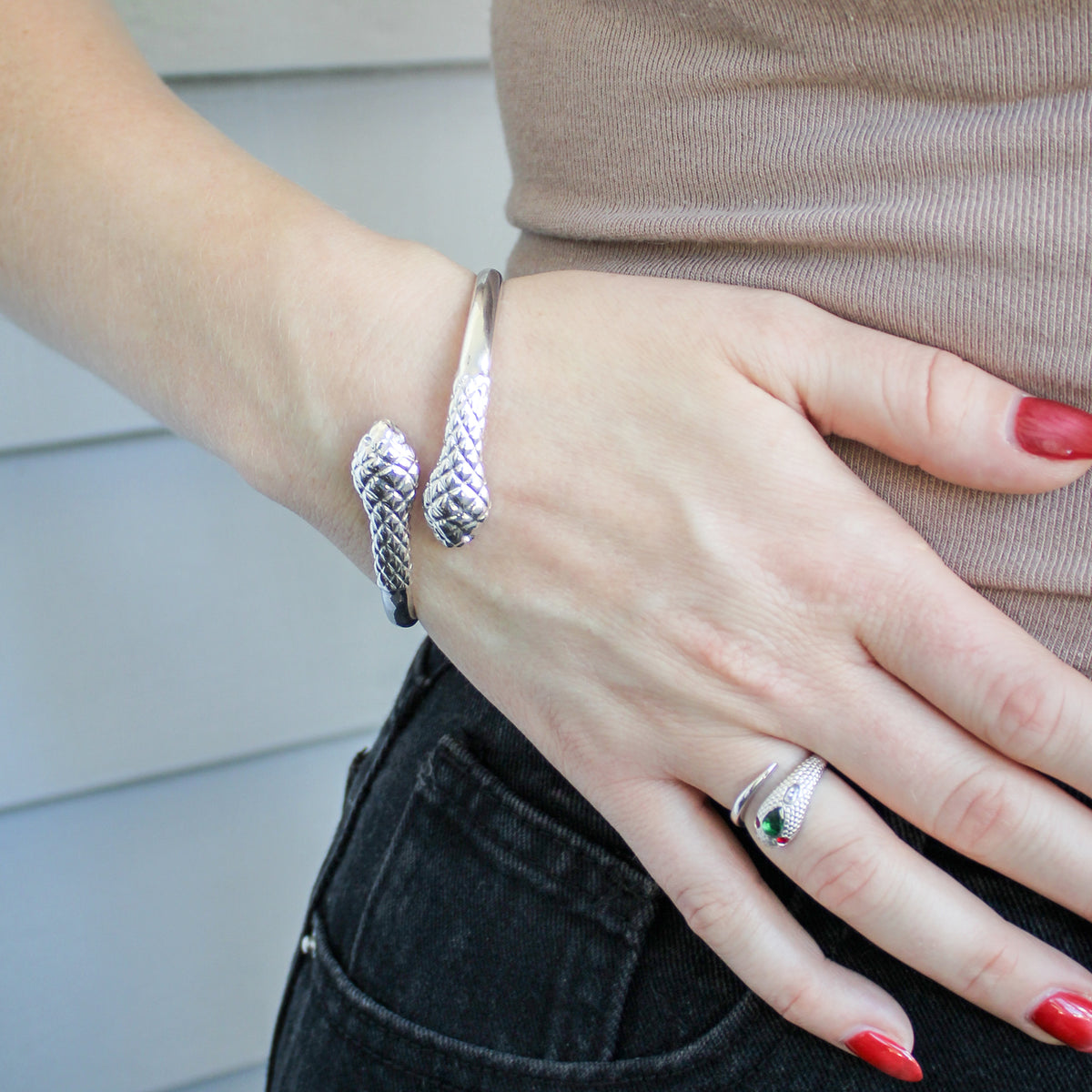 Sterling silver Serpentine Bracelet styled with ring on model, coiled serpent scale bangle, Ether Jewelry