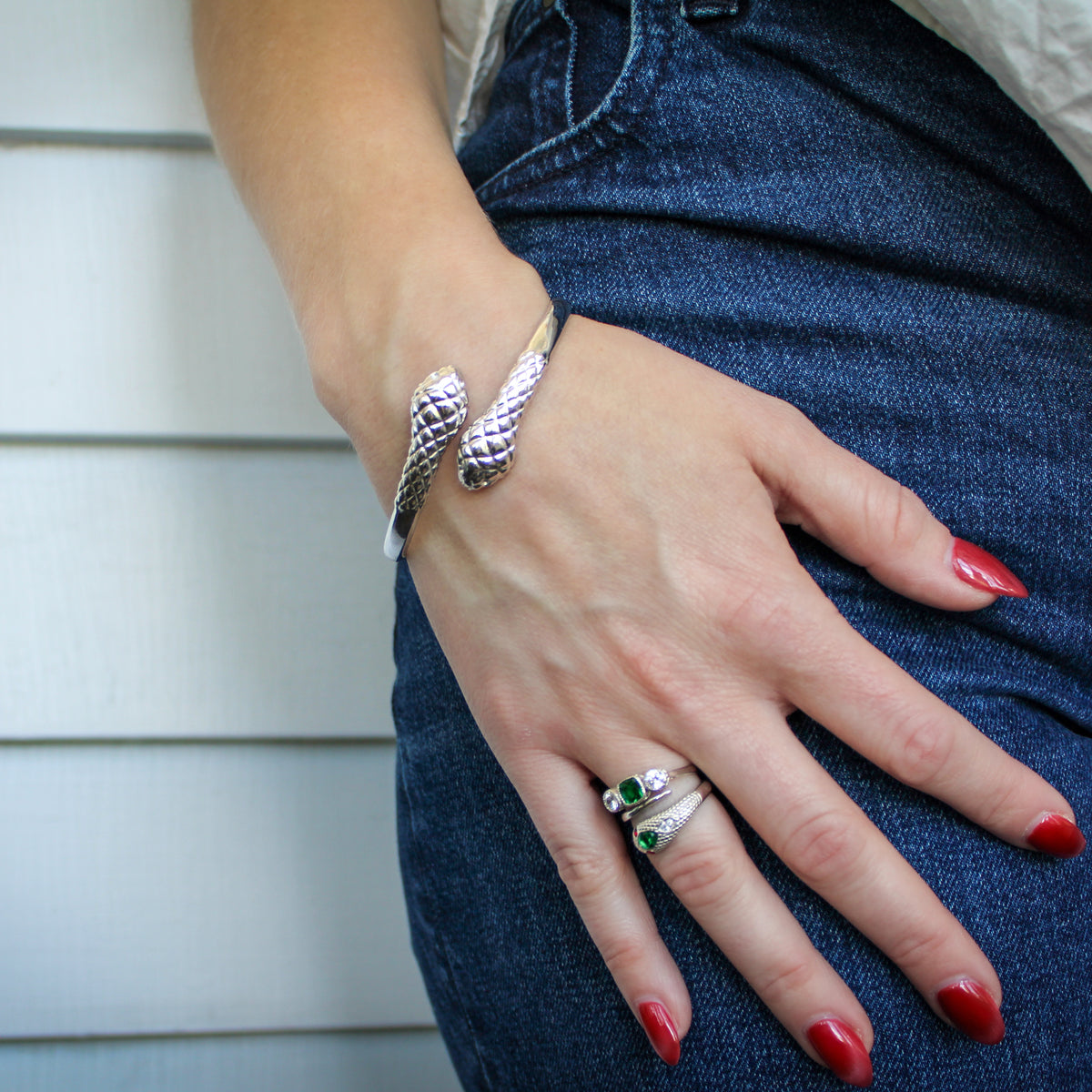 Serpentine Bracelet in sterling silver worn on model wrist, coiled snake bangle with scale texture, Ether Jewelry