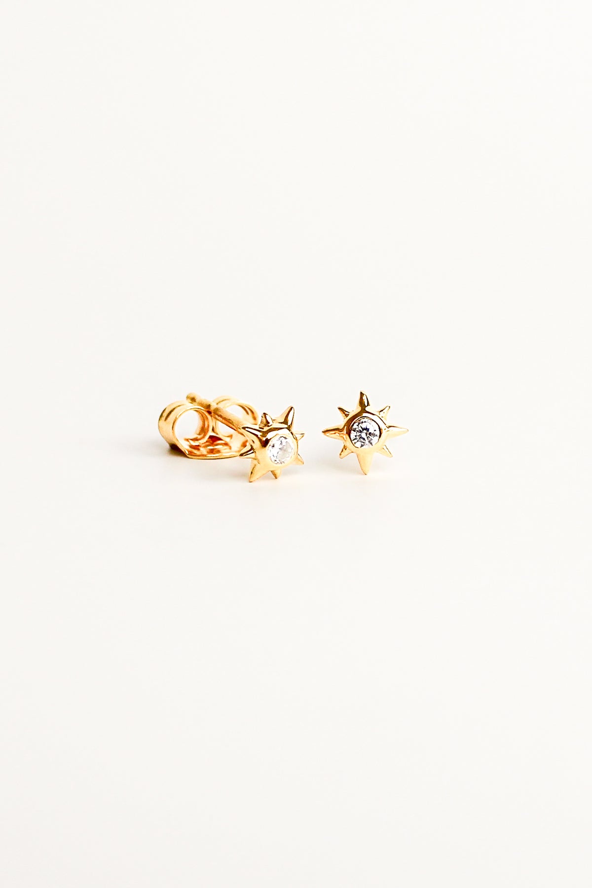 Stella Stud Earrings in 18k gold vermeil, dainty north star CZ stud earrings, white background, Ether Jewelry