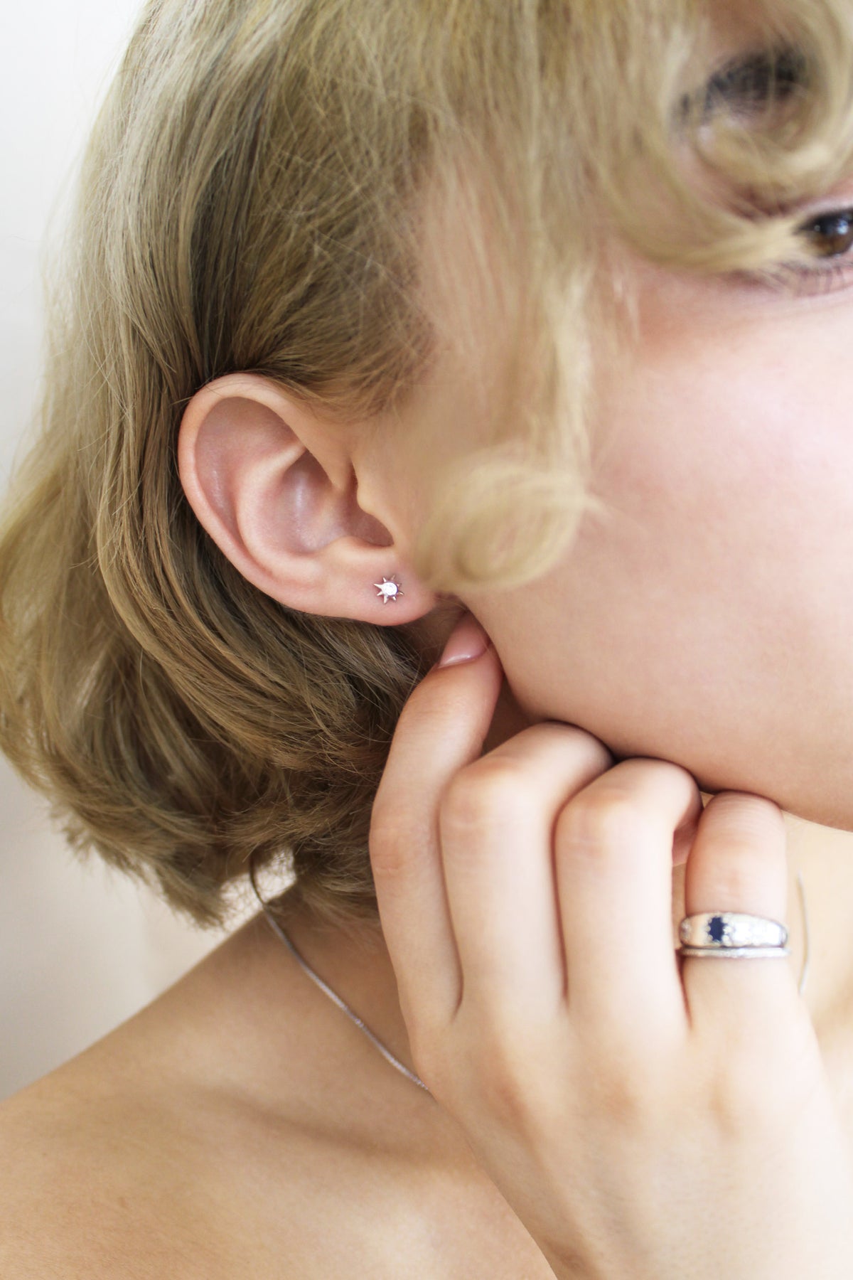 Stella Stud Earrings in sterling silver on model, dainty north star CZ stud earrings, Ether Jewelry