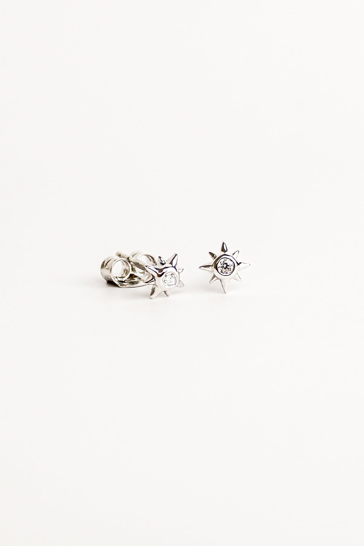 Stella Stud Earrings in sterling silver, dainty north star CZ stud earrings, white background, Ether Jewelry
