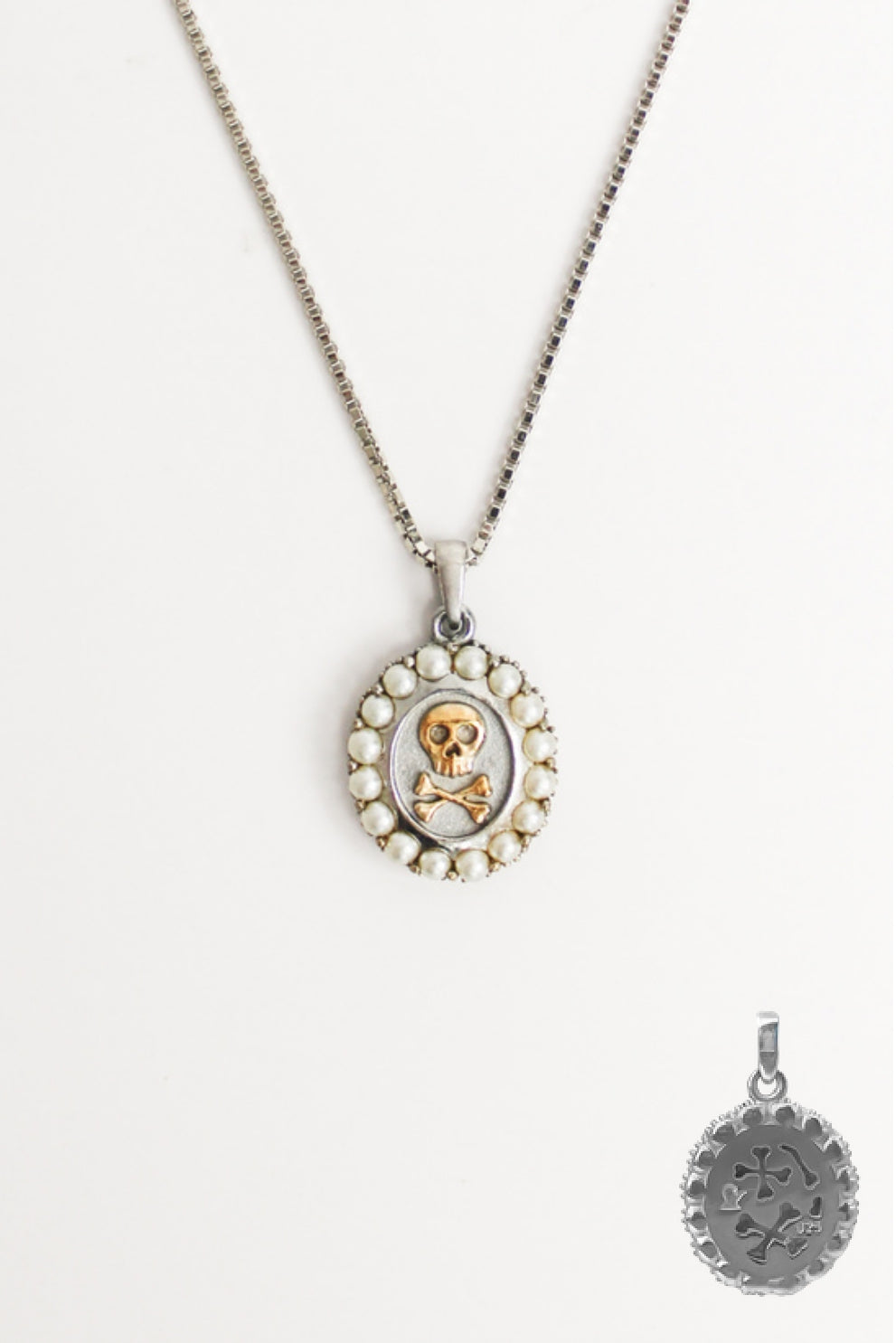 Mourning Memento Necklace in sterling silver, oval pendant with raised skull and crossbones and cultured pearl halo border on box chain, Ether Jewelry