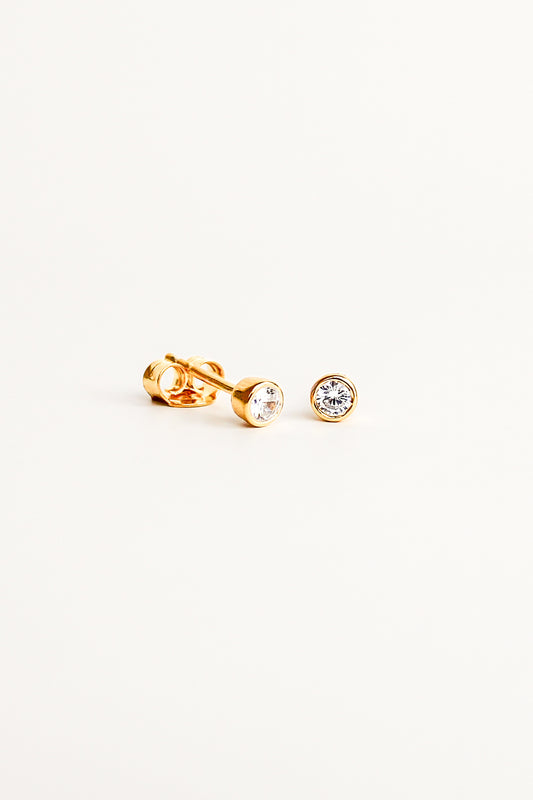 esta Stud Earrings in 18k gold vermeil, dainty bezel-set round CZ stud earrings, white background, Ether Jewelry
