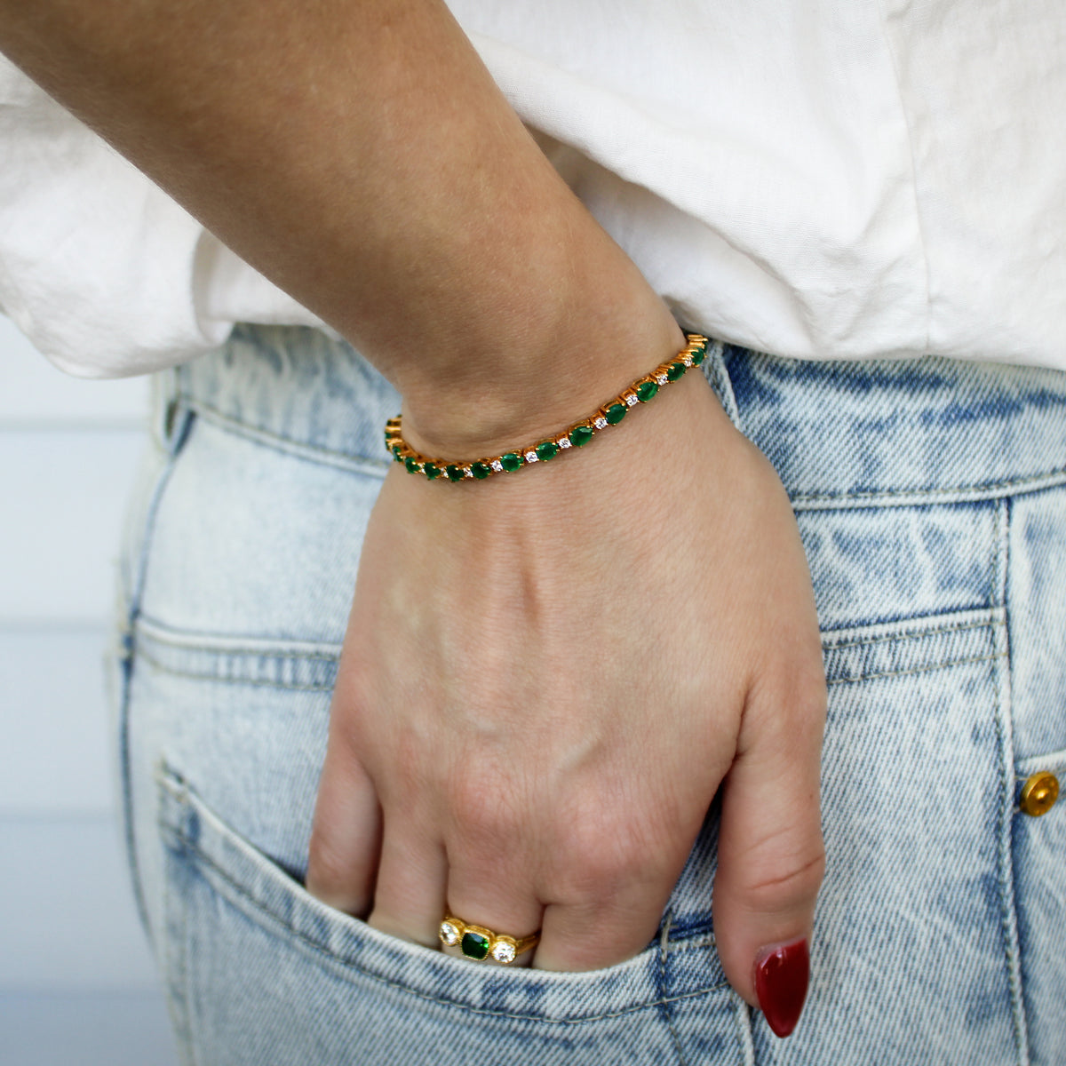 Victorian Court Bracelet in 18k gold vermeil on model hand in pocket, green onyx and white CZ tennis bracelet, Ether Jewelry