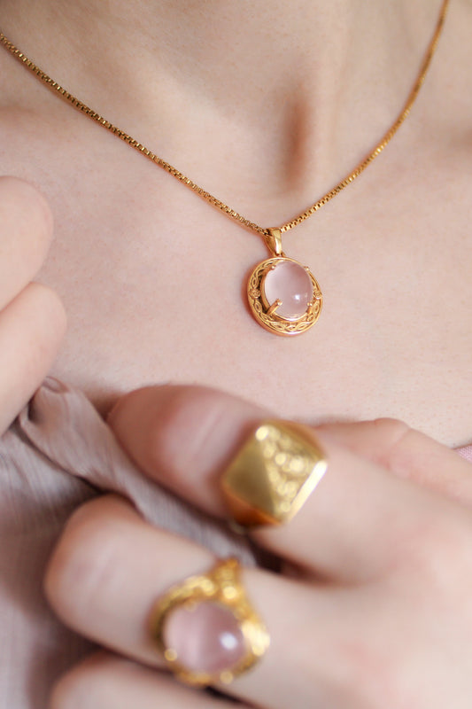 Romantic Heir Necklace in 18k gold vermeil worn on model with matching Romantic Heir Ring, oval rose quartz filigree pendant, Ether Jewelry
