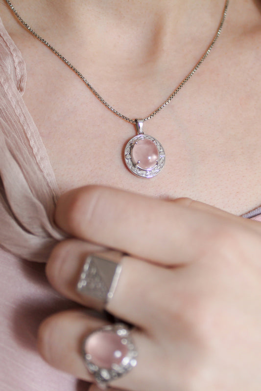 Romantic Heir Necklace in sterling silver worn on model with matching Romantic Heir Ring, oval rose quartz filigree pendant, Ether Jewelry