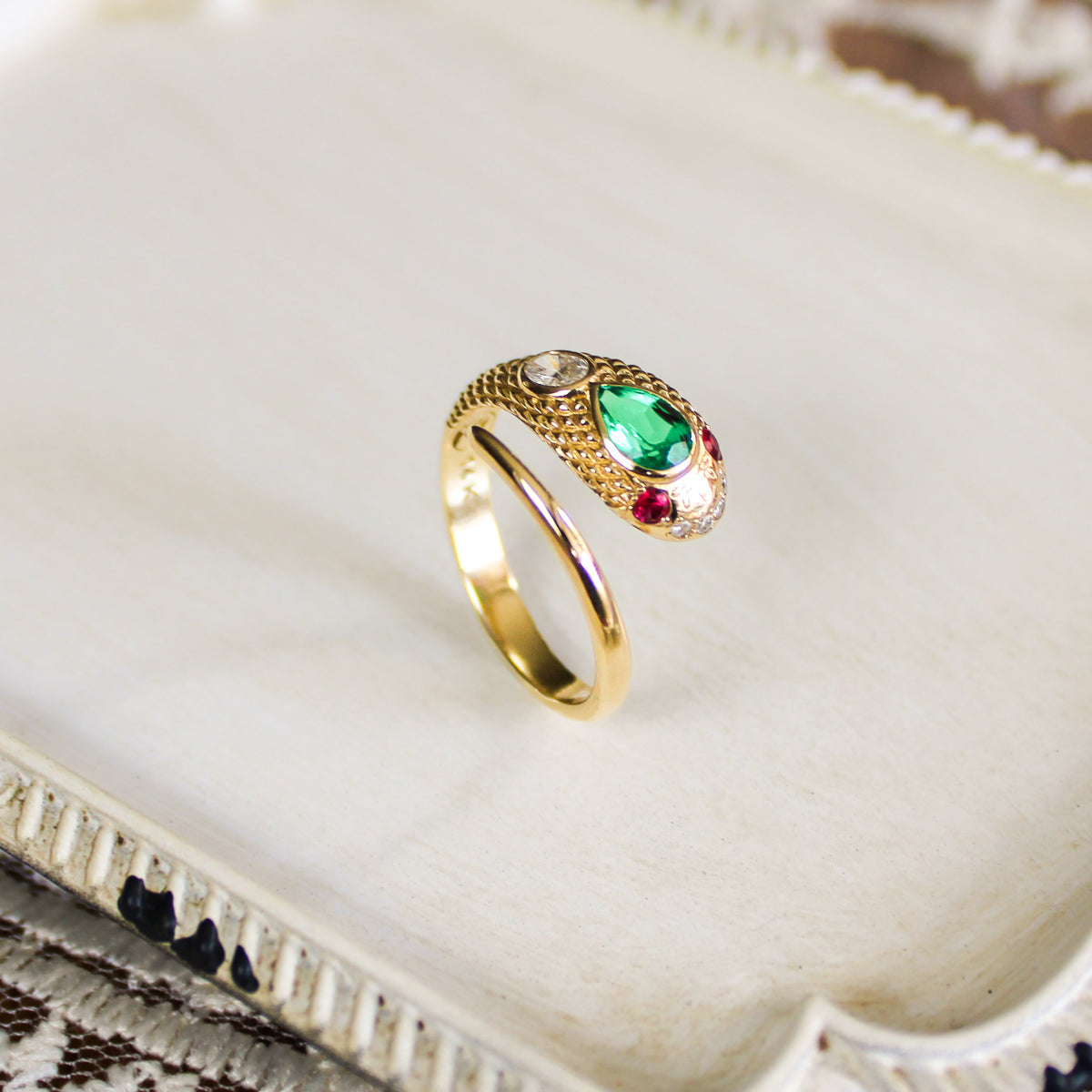 Queen Victoria 14k gold snake ring upright on tray showing scale engraving detail, lab-grown emerald ruby diamond Victorian serpent ring, Ether Jewelry